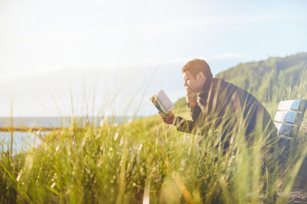 person reading mystery book